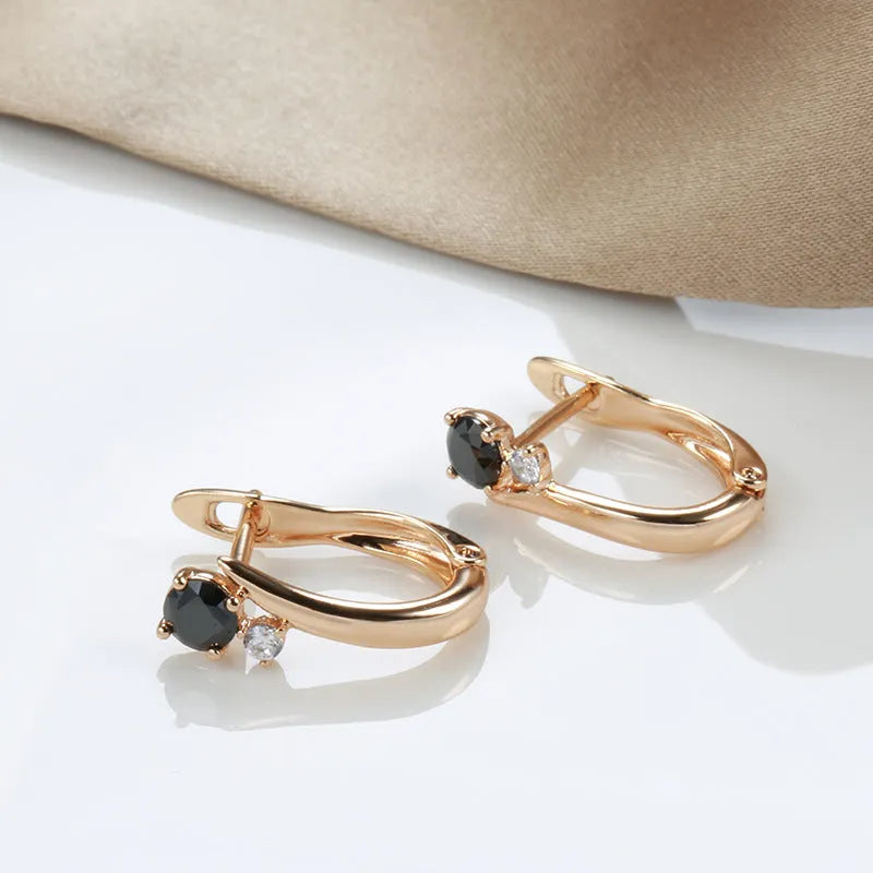 Gold-plated drop earrings with black agate stones in retro geometric design