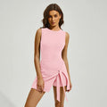 Women's solid colour sports skirt dress with back shaping, shown in Barbie Pink.