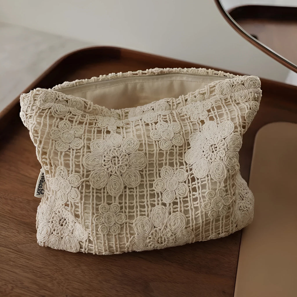 Handmade corduroy cosmetic bag with crocheted hollow flower embroidery