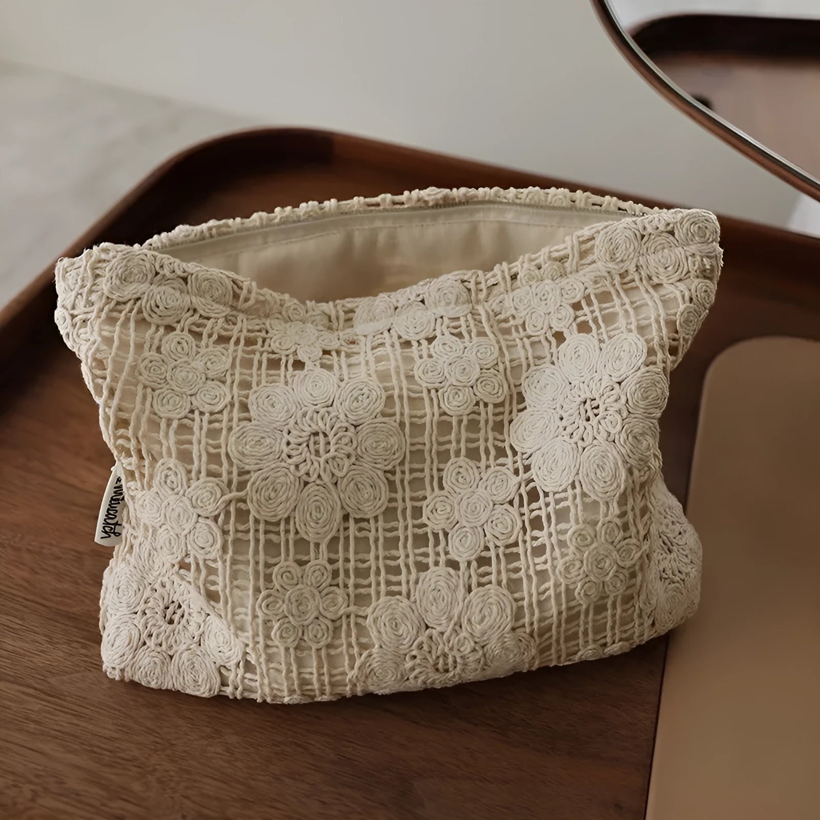 Handmade corduroy cosmetic bag with crocheted hollow flower embroidery