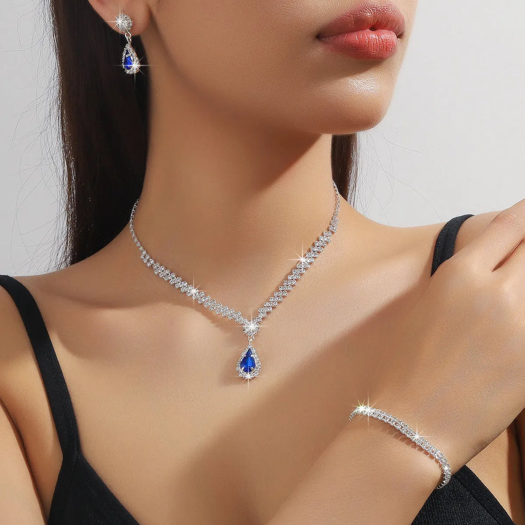 Claw chain necklace and earrings set with water drop rhinestones in blue colour