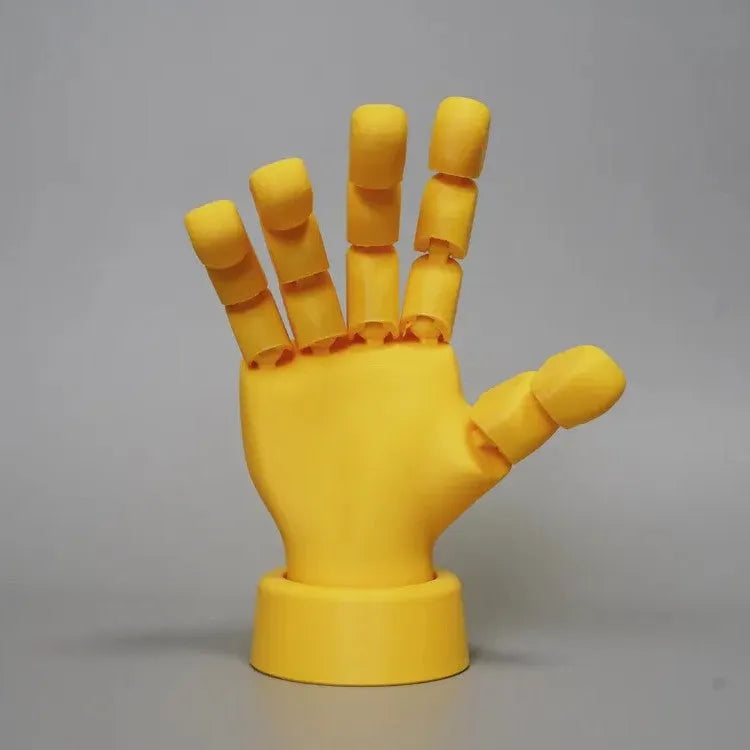 Yellow PLA movable joint hand ornament figurine on a white background.