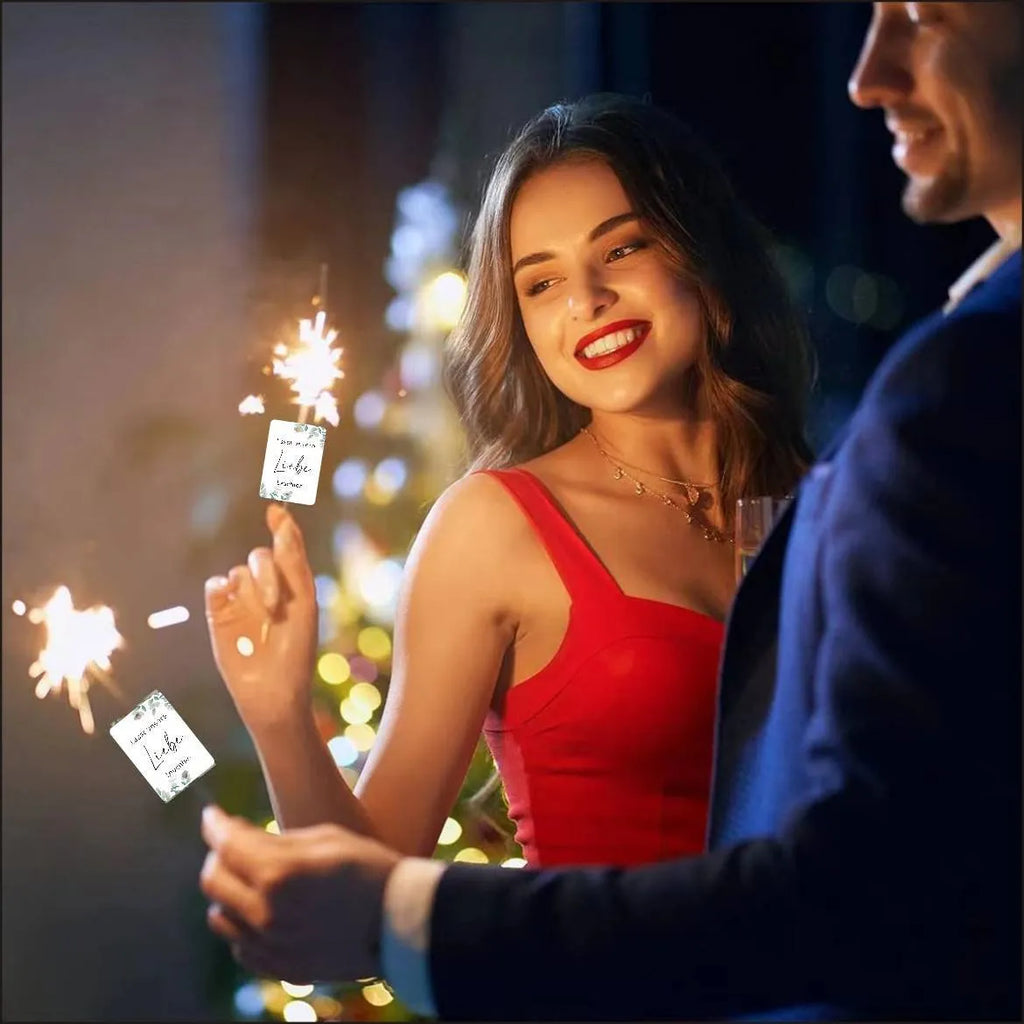 Pack of 50 white decorative paper labels with Fireworks and I Make Love print for events.