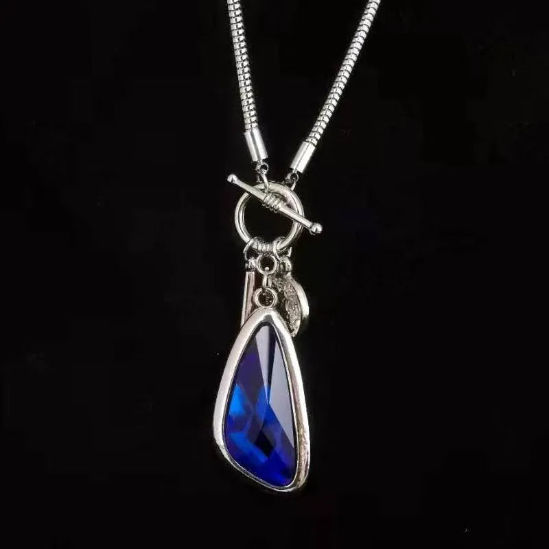 Long women's necklace with geometric pendant on snake bones chain