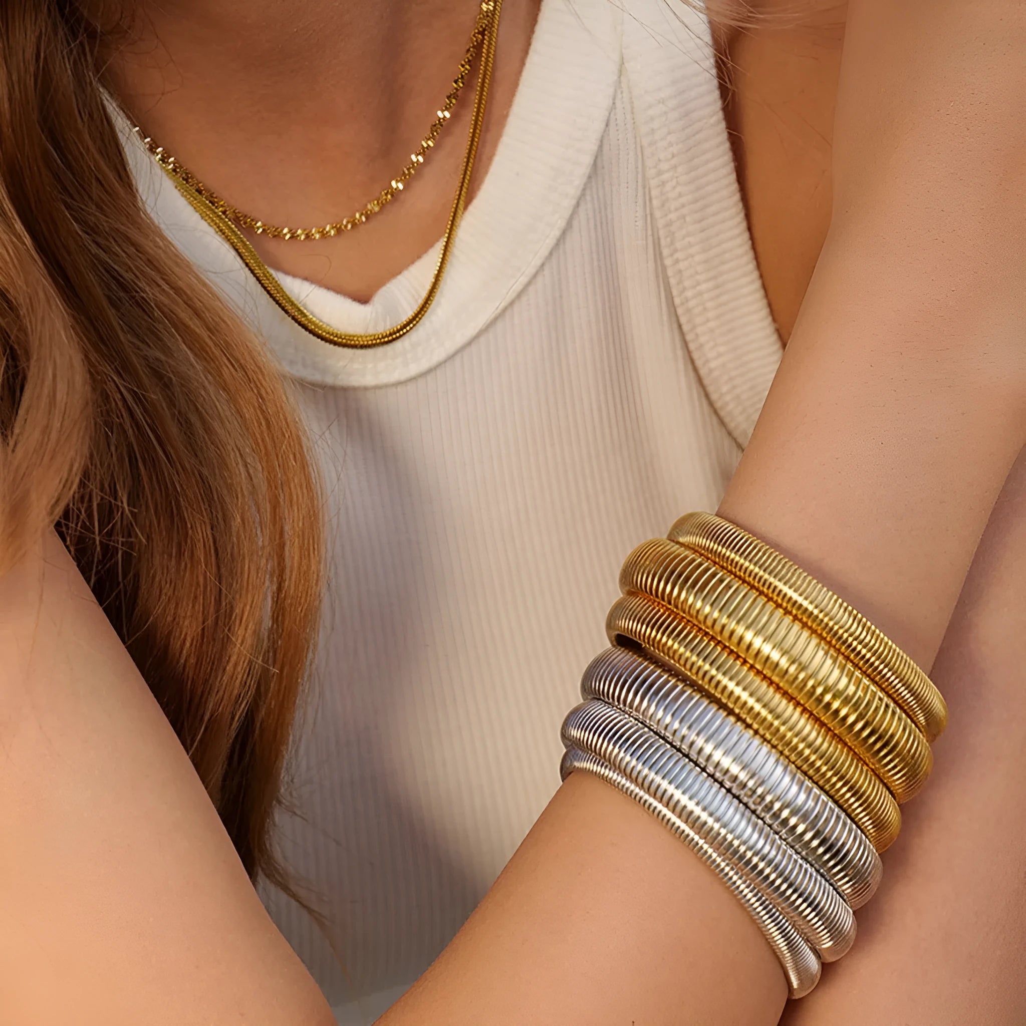 Women's titanium steel elastic bracelet with vertical stripe ring pattern in gold electroplated finish