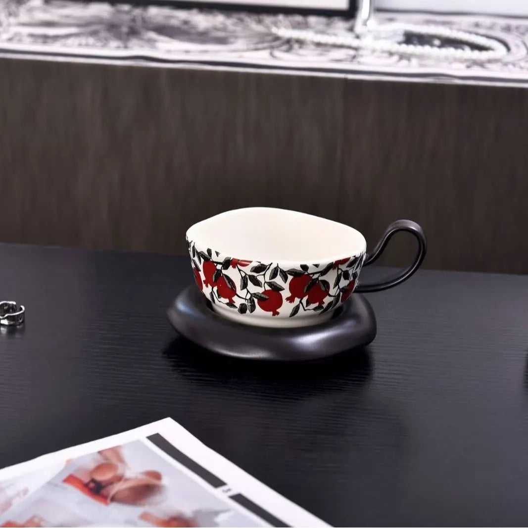 Antique-style ceramic coffee cup and saucer set in black or orange with 210ml capacity
