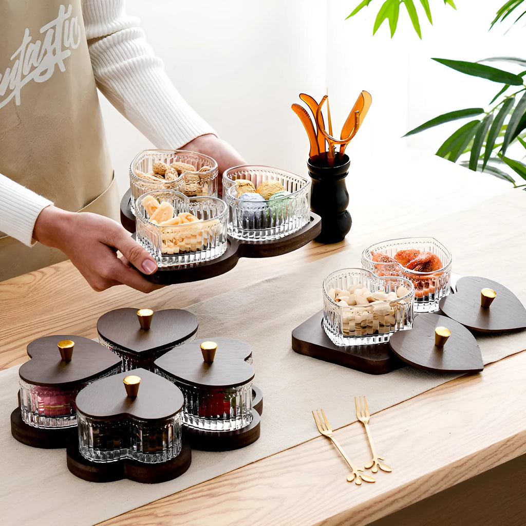 Glass fruit platter with transparent heart-shaped lids in compartmentalised serving tray
