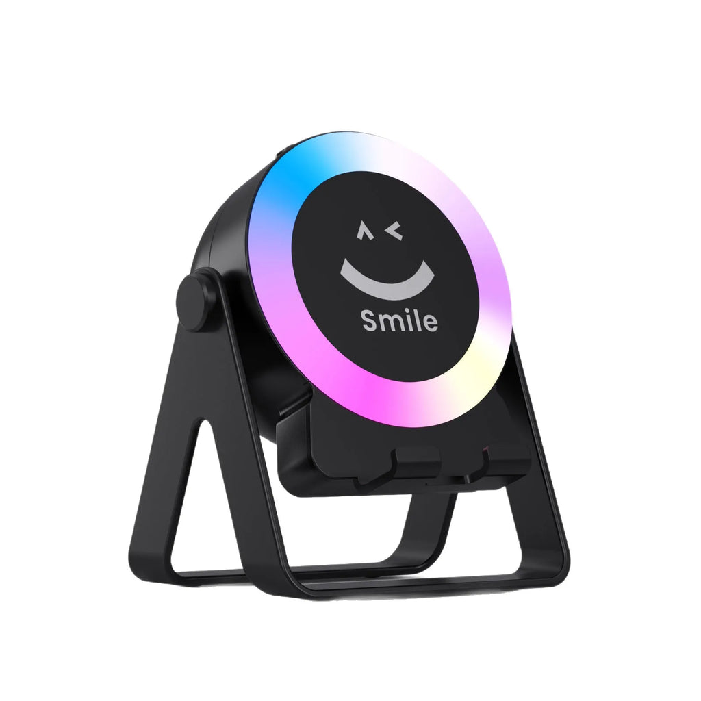 Black and white Bluetooth speaker with LED lighting on induction charging bracket