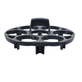 A black plastic egg holder rack on a kitchen countertop.