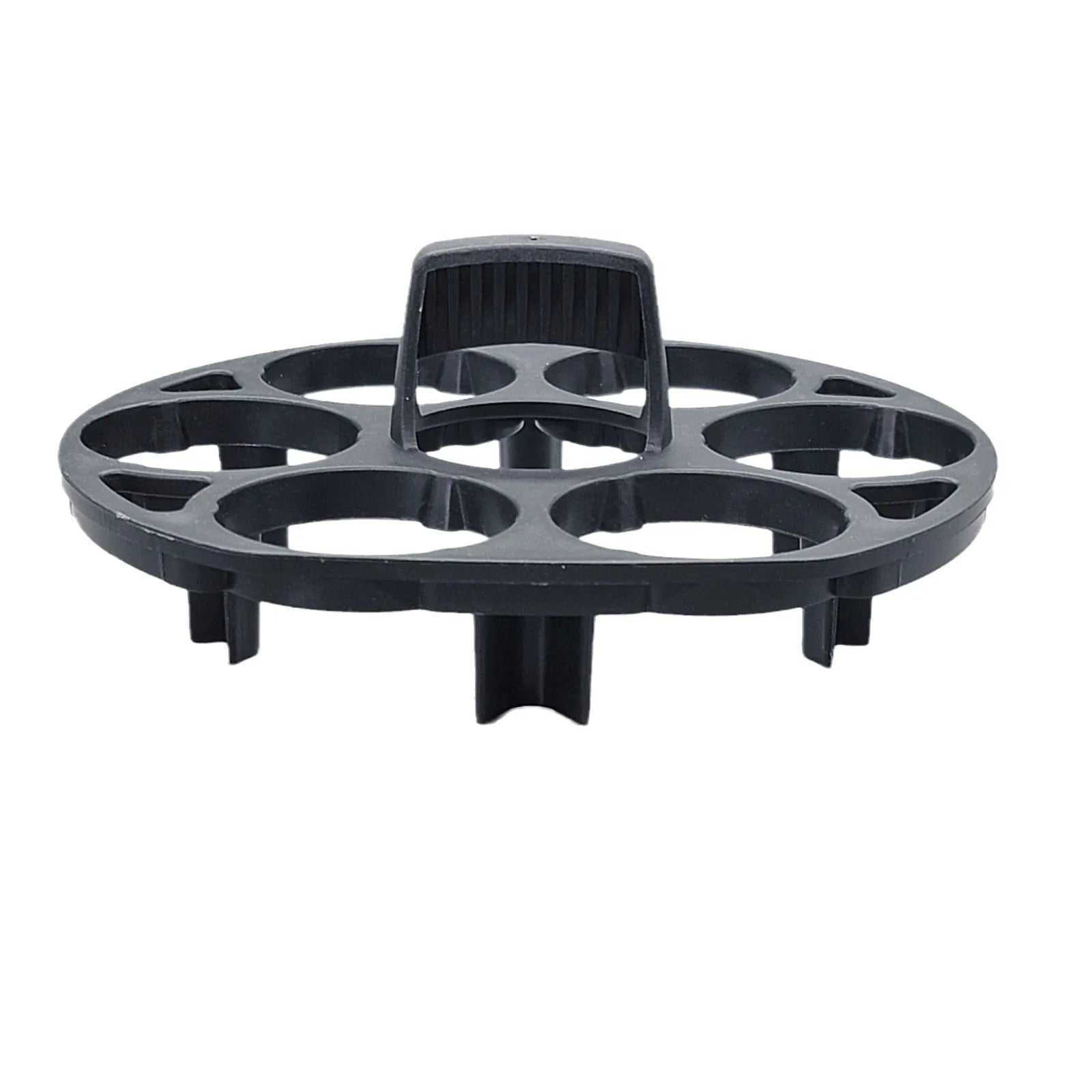 A black plastic egg holder rack on a kitchen countertop.