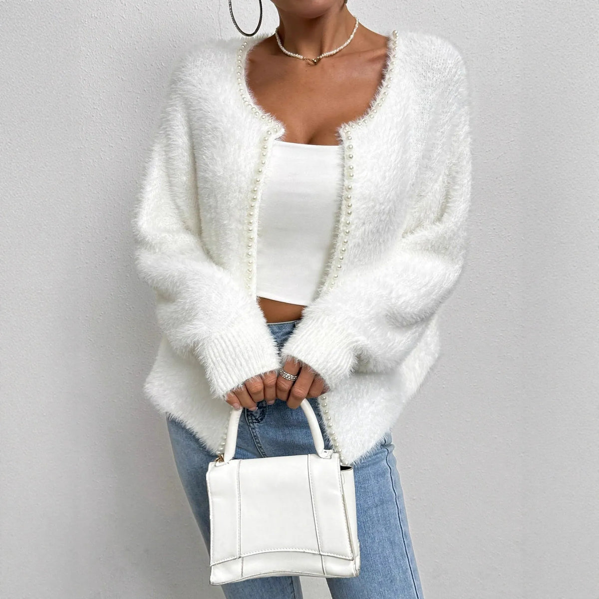 Women's white V-neck cardigan sweater with bead knitwork detailing