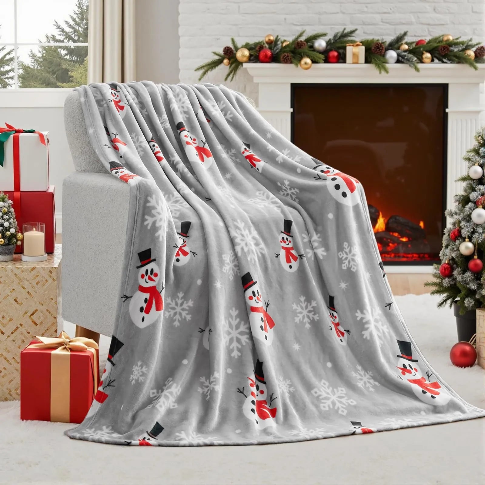 Soft red flannel Christmas blanket draped over a sofa, showing its plush texture and generous size.