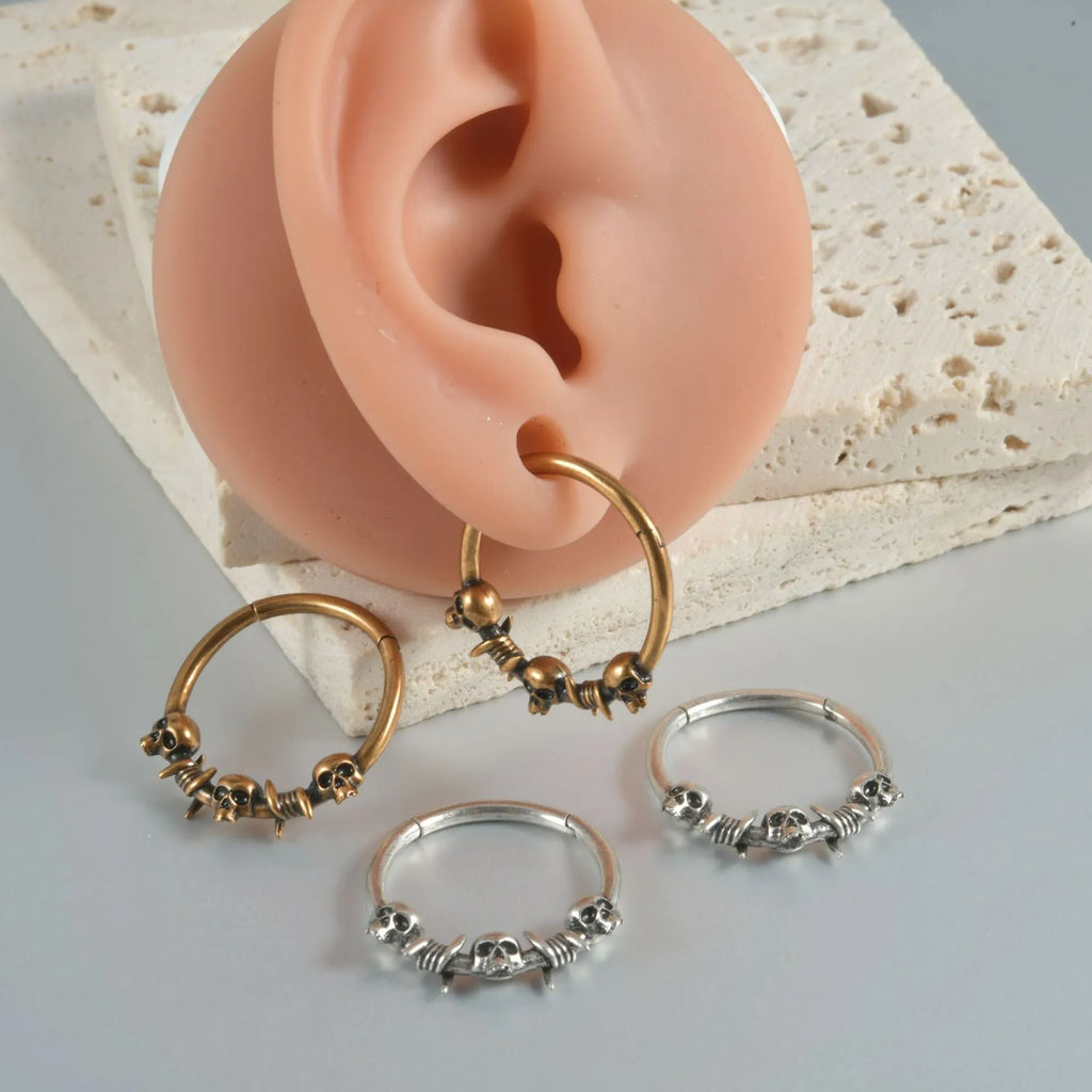 Antique silver and gold punk copper earrings with ghost head designs