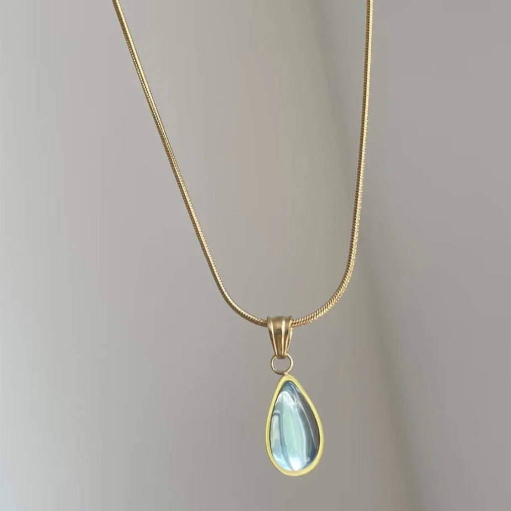Retro blue and green water drop necklace with mixed gem inlaid pendant on titanium steel snake bone chain.