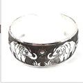 Silver alloy ethnic bracelet with carved Miao openwork patterns in turtle colour option