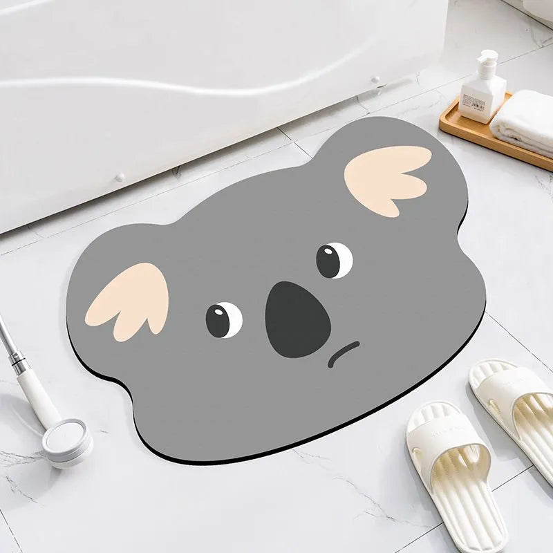 Cartoon animal design diatom oil bathroom mat in alien shape on bathroom floor.