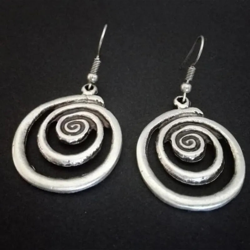 Retro geometric spiral distressed silver earrings showing 2.6cm width and 5cm length dimensions
