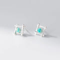 Women's geometric cross-shaped quadrangle stud earrings in sterling silver on a white background.