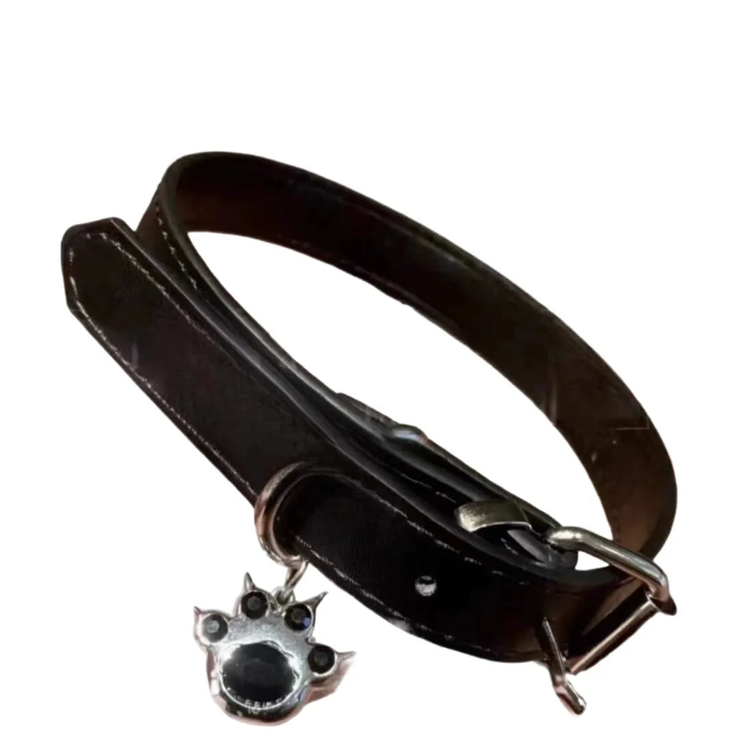 Black leather dog collar with bell pendant showing adjustable design from 21cm to 50cm perimeter