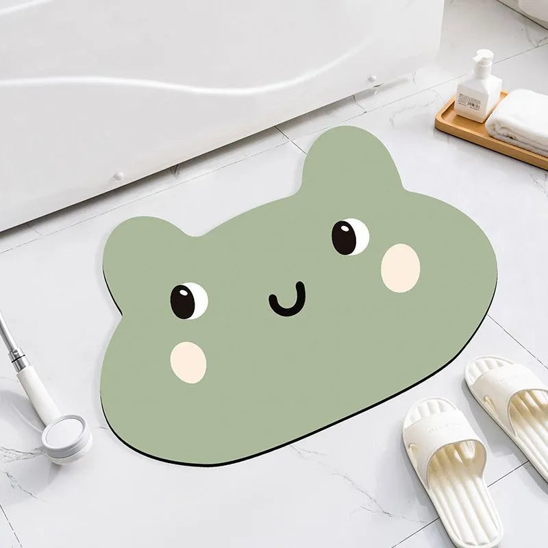 Cartoon animal design diatom oil bathroom mat in alien shape on bathroom floor.