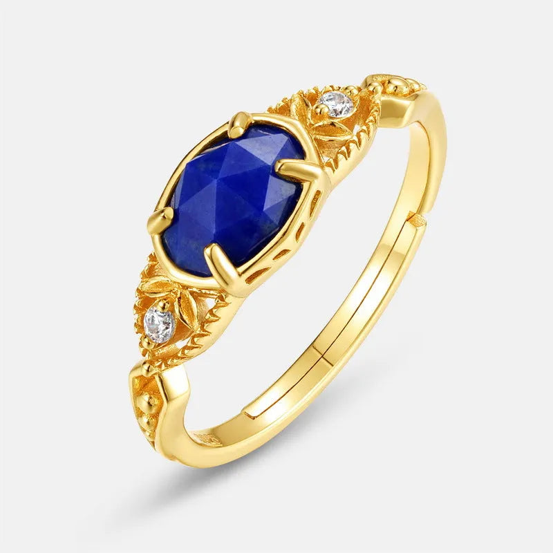 Geometric silver women's ring with a blue oval lapis lazuli gemstone.
