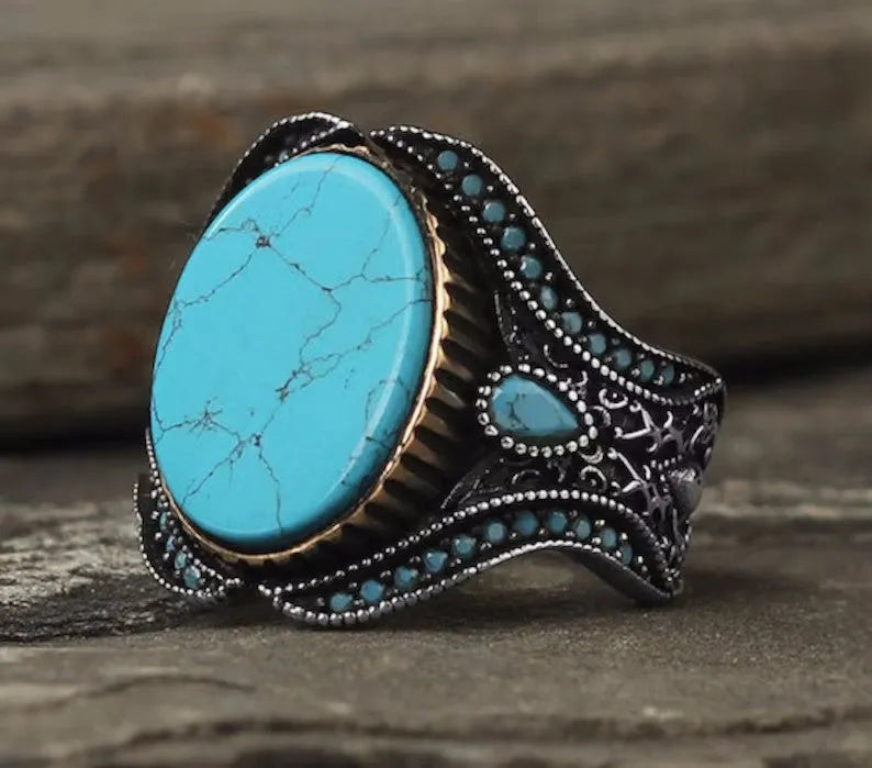 Men's round turquoise antique silver alloy ring showing simple design on size chart