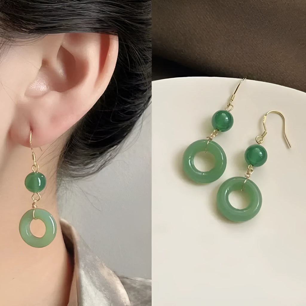 Green Chinese cheongsam peace buckle shape earrings with geometric design elements