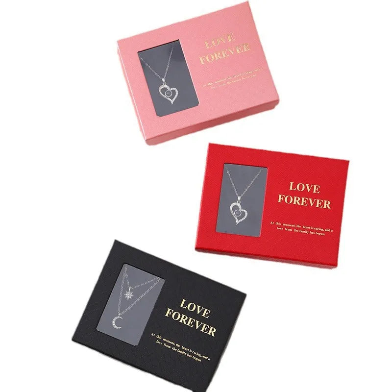 Six red soap flower roses in a black gift box with decorative handbag for Valentine's Day presents.