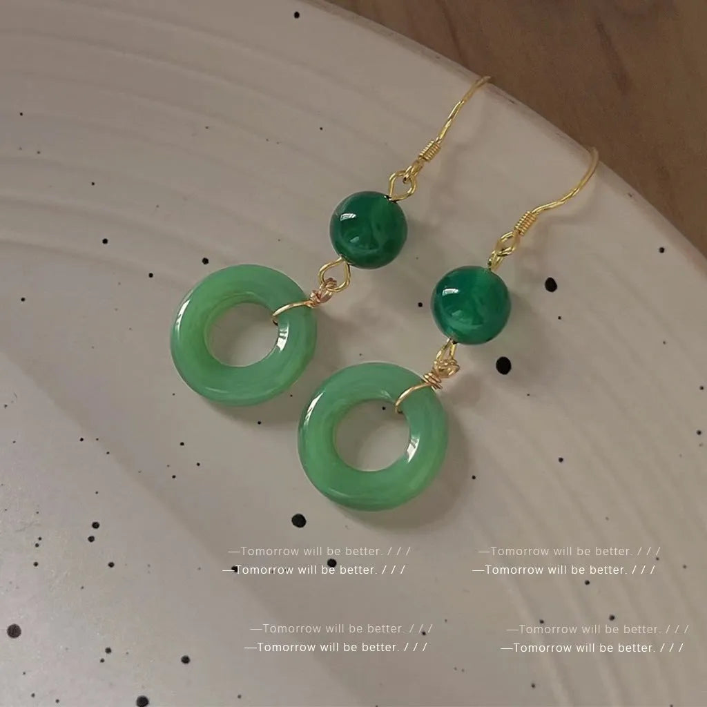 Green Chinese cheongsam peace buckle shape earrings with geometric design elements