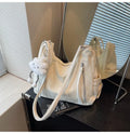 Women's PU leather fashion backpack in beige, black, blue, or silver with pendant accessory