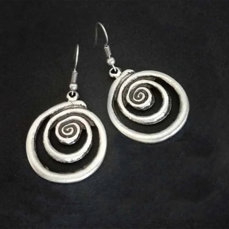 Retro geometric spiral distressed silver earrings showing 2.6cm width and 5cm length dimensions