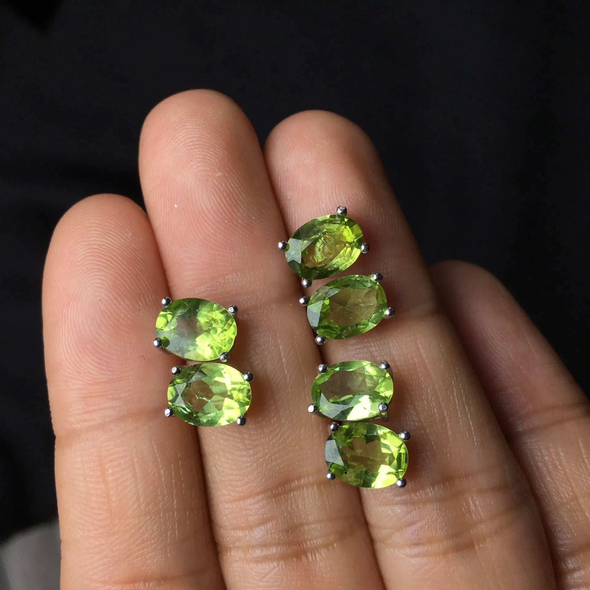 Grass green natural olivine stud earrings in sterling silver, elliptical stones 6x8mm.