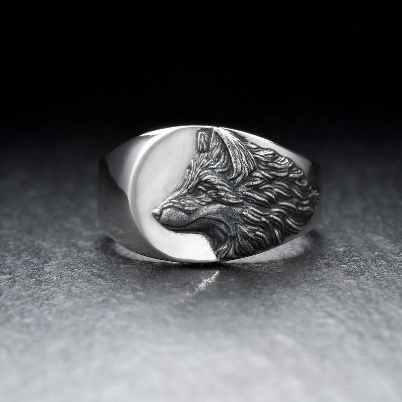 Men's geometric wolf head alloy statement ring in silver finish on a size guide showing options 6 to 12.