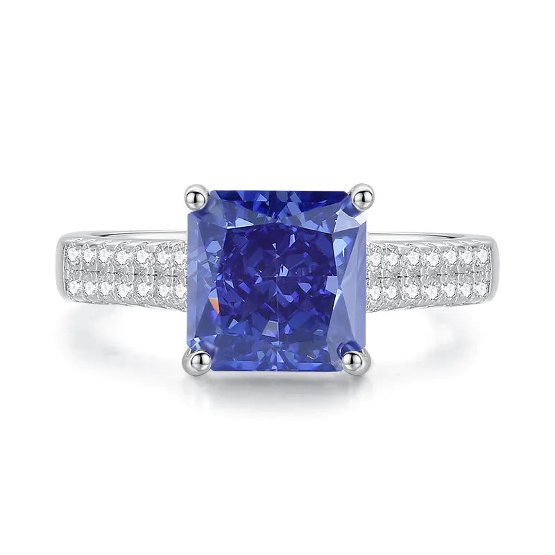 Heart-shaped sterling silver ring with an ice flower cut tan sang zircon stone on a white background.