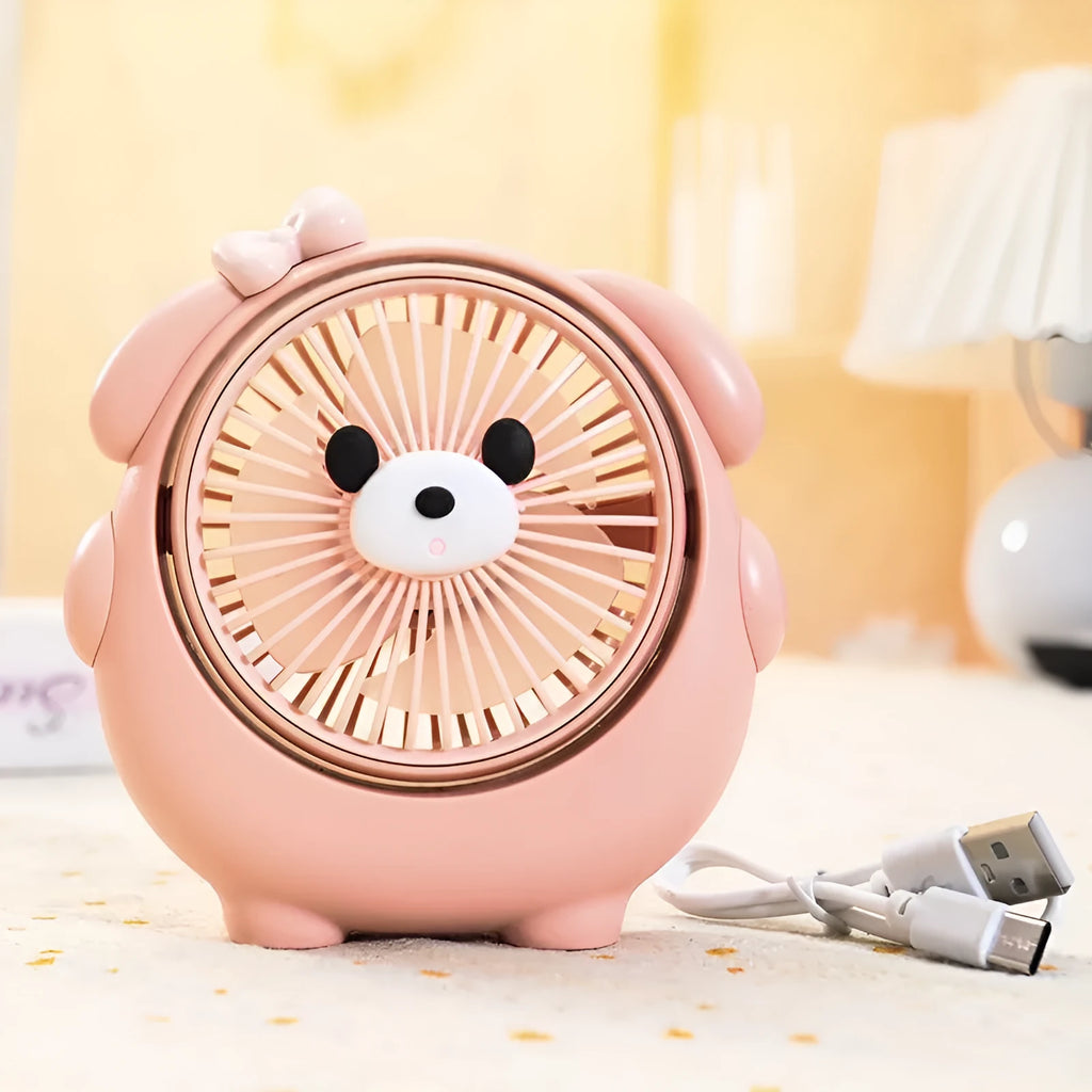 Cute dog-themed USB desktop electric fan in a choice of six colours on a wooden desk.