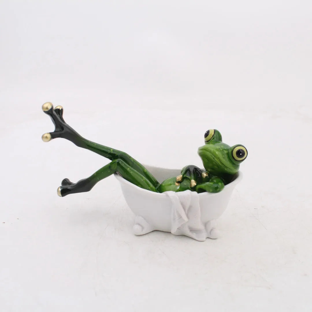 Synthetic resin pastoral style frog figurine home decoration ornament on a surface.