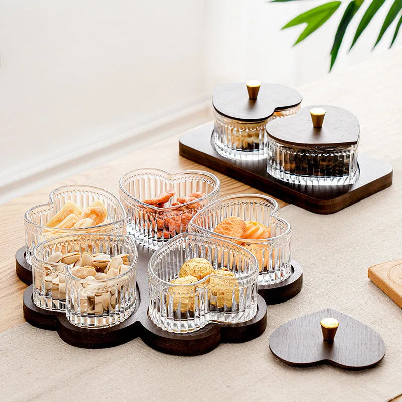 Glass fruit platter with transparent heart-shaped lids in compartmentalised serving tray