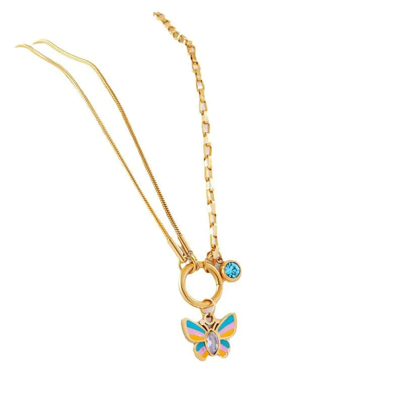 Gold colour epoxy butterfly jewellery set with titanium steel necklace and bracelet showing snake bones chain style