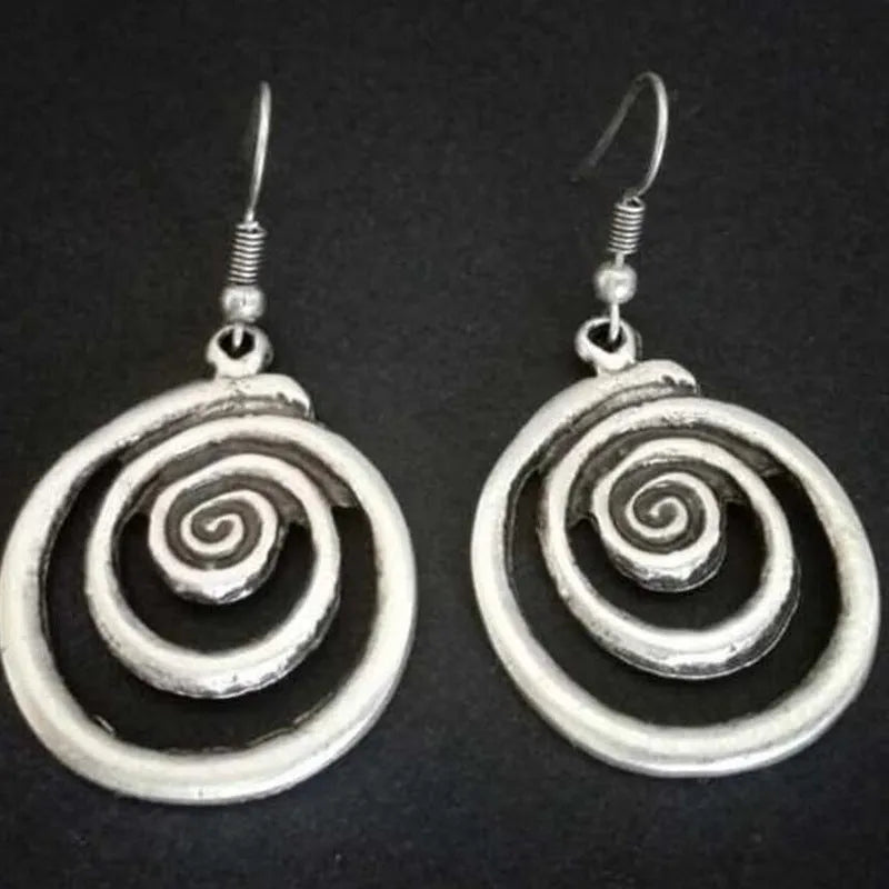 Retro geometric spiral distressed silver earrings showing 2.6cm width and 5cm length dimensions