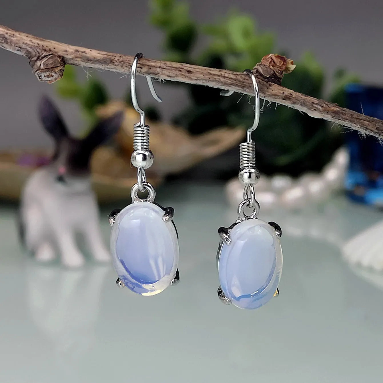 Moonlight White opal-coloured drop earrings with an ellipse design on a retro-inspired alloy setting.