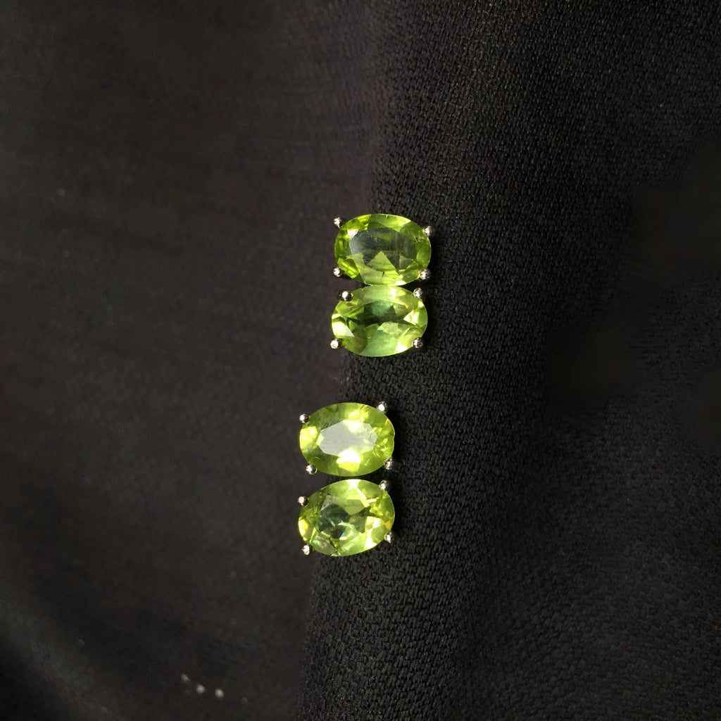 Grass green natural olivine stud earrings in sterling silver, elliptical stones 6x8mm.