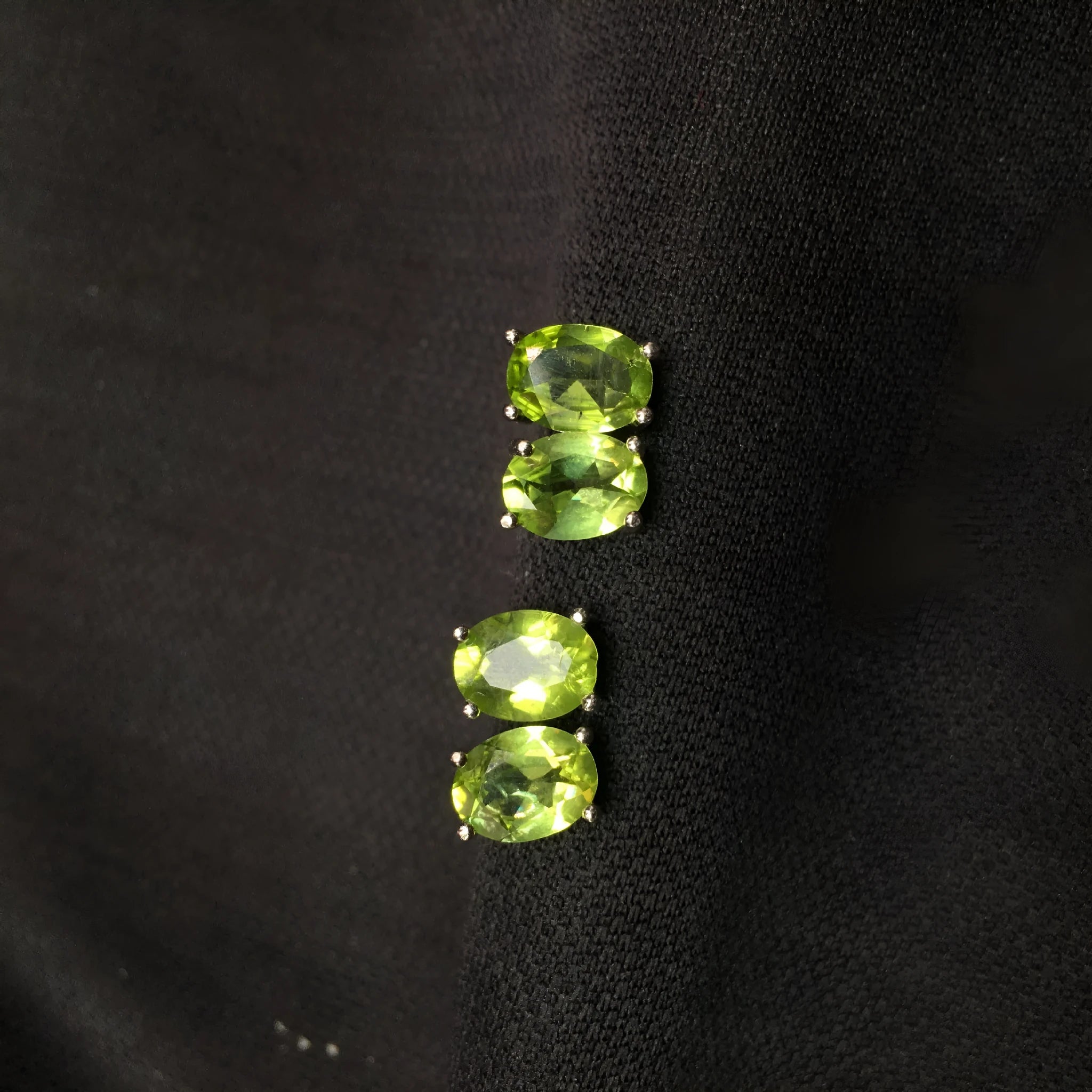 Grass green natural olivine stud earrings in sterling silver, elliptical stones 6x8mm.
