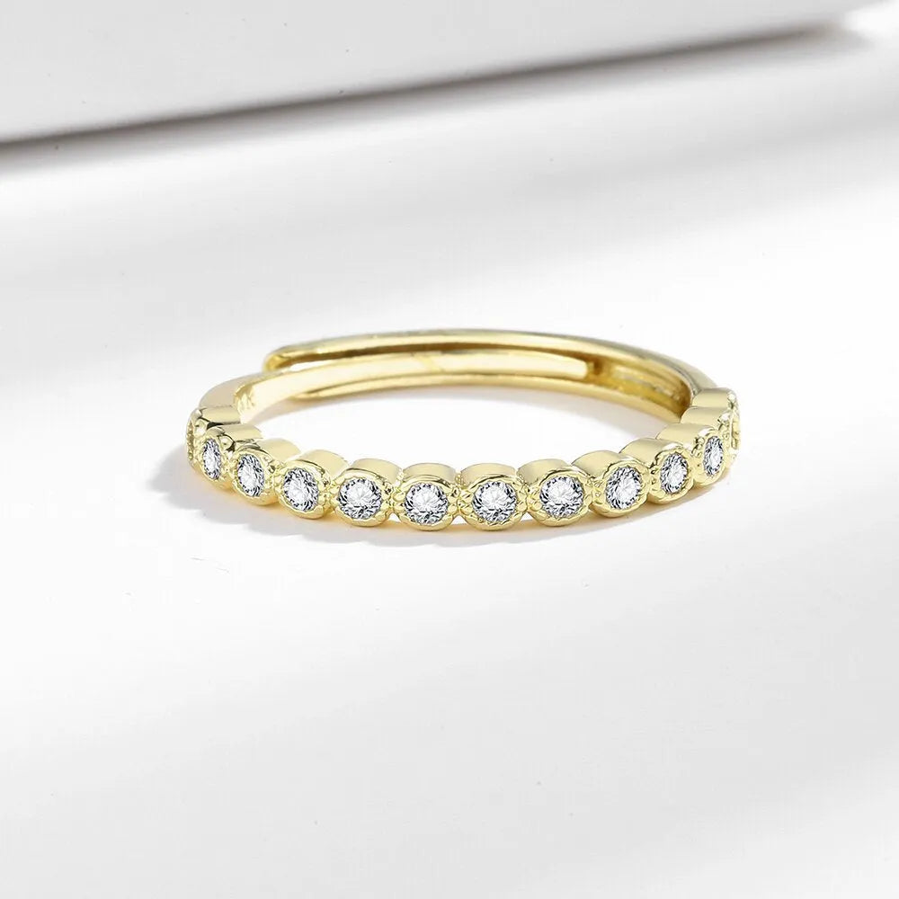 Geometric open mouth copper ring in electroplated white gold colour on a model's hand.