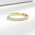 Geometric open mouth copper ring in electroplated white gold colour on a model's hand.