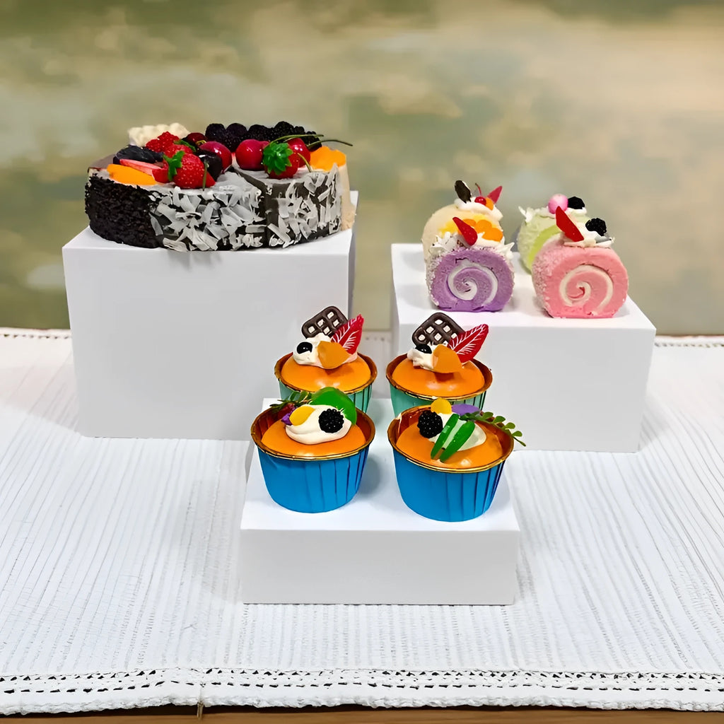 White plastic cube dessert display stand with stackable units for tiered cake and pastry presentation