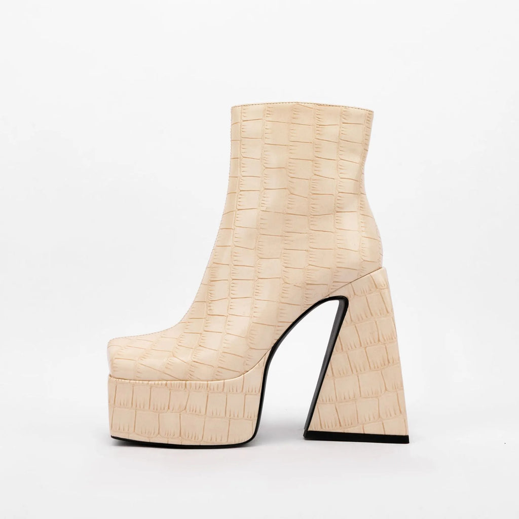 Women's solid colour ankle boot with a high heel, shown in an available colour like red or black.