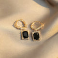 Geometric quadrilateral copper earrings with black zirconia centrepiece in French Court Retro style for women.