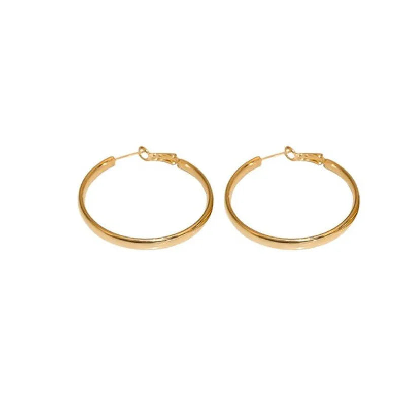 Metal circle earrings with gold or silver electroplated finish measuring 40mm diameter