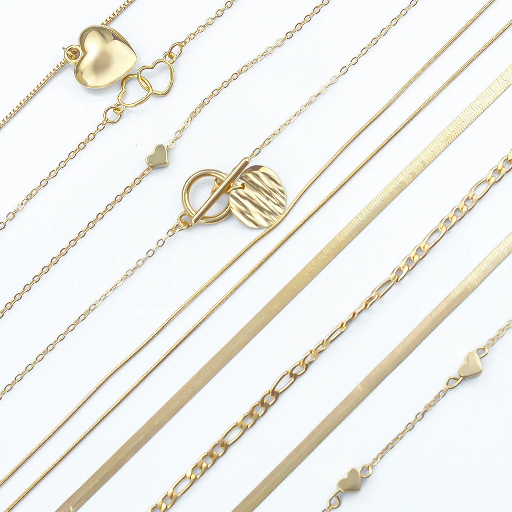 10-piece women's jewellery set with gold necklace featuring alloy pendant on snake bones chain