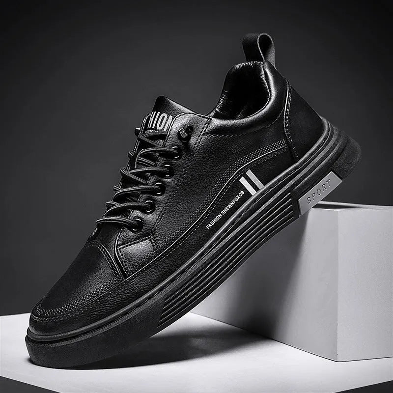 Men's low-top skate shoes with elastic band, microfiber upper, and round toe in black and white.